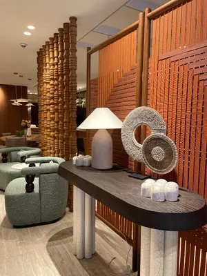 a lobby with a table with a lamp and chairs at Housez Suites & Apartments Special Class in Istanbul