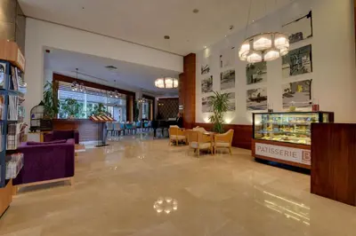 a lobby of a store with tables and chairs at Baia Bursa Hotel in Bursa