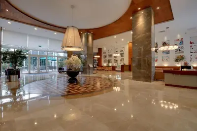 a lobby with a vase with flowers in it at Baia Bursa Hotel in Bursa