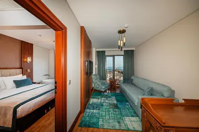 a hotel room with a bed and a couch at Triton Hotel in Istanbul