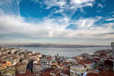 a city view of the water and buildings at Cihangir Hotel Bosphorus in Istanbul