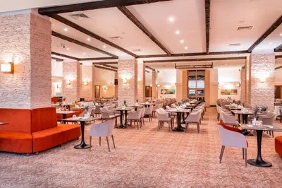 a dining room with tables and chairs at Monte Baia Uludağ in Uludag