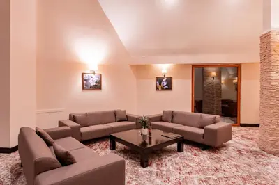 a living room with couches and a coffee table at Monte Baia Uludağ in Uludag