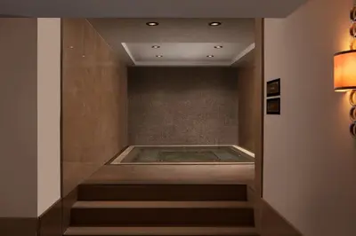 a walkway with a bath tub in a room at Istanbul Marriott Hotel Pendik in Istanbul