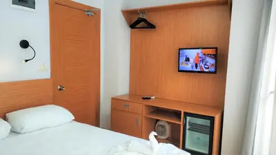 a bedroom with a bed and a tv on a wall at Bucoleon by Cheers in Istanbul