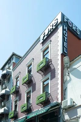 a building with a sign on the side of it at Fors Hotel in Istanbul