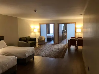 a hotel room with a bed and a living room at Hotel Fehmi Bey - Special Category in Istanbul