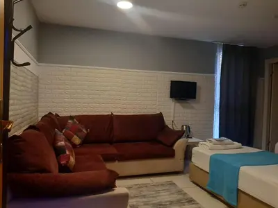 a living room with a couch and a table at 216 Turkuaz Suit in Istanbul