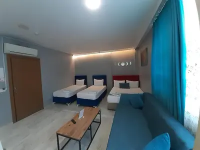 a living room with two beds and a couch at 216 Turkuaz Suit in Istanbul