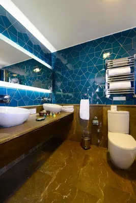 a bathroom with two sinks and a large mirror at Agora Life Hotel - Special Class in Istanbul