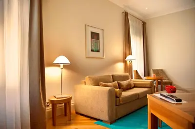 a living room with a couch and a table at Tomtom Suites in Istanbul