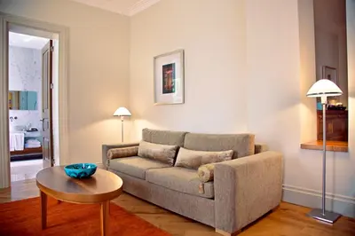 a living room with a couch and a table at Tomtom Suites in Istanbul