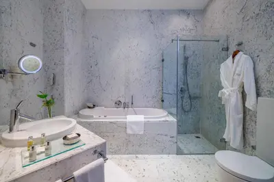 a bathroom with a sink toilet and a shower at Tomtom Suites in Istanbul