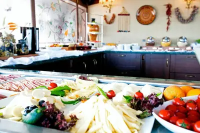 a buffet with many different types of food on a table at Apart Hotel Hippodrome in Istanbul
