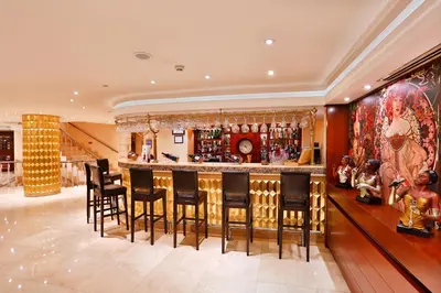 a bar in a home with black bar stools at Mosaic Hotel Old City -Special Category in Istanbul