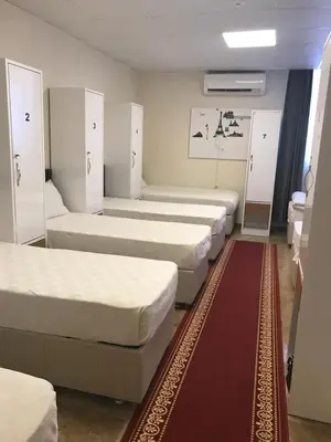 a room with a bunch of beds in it at Express İnci Hotel in Istanbul