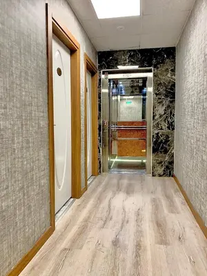 an empty hallway with an elevator in a building at Express İnci Hotel in Istanbul