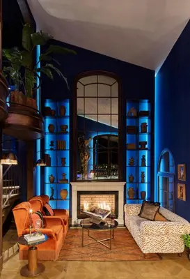 a blue living room with a couch and a fireplace at Mr Cas Hotels Taksim - Special Category in Istanbul