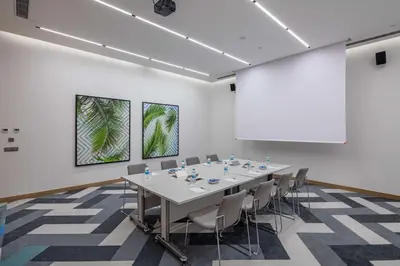 a conference room with a long table and chairs at Hampton by Hilton Istanbul Zeytinburnu in Istanbul