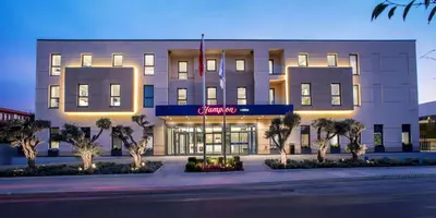 a building with a sign on the front of it at Hampton by Hilton Istanbul Zeytinburnu in Istanbul