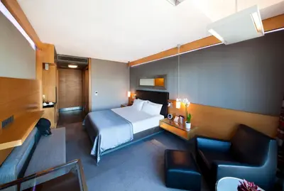 a hotel room with a bed and a couch at Point Hotel Barbaros in Istanbul