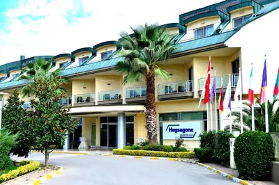 a hotel building with flags in front of it at Hotel Hegsagone Marine Asia in Gebze