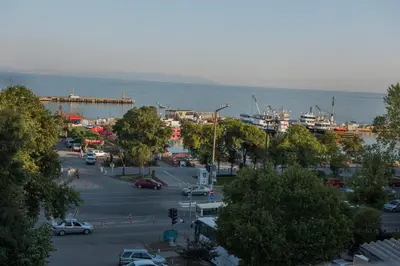 a city with a parking lot next to the water at Rodosto Hotel in Tekirdag