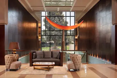 a living room with a couch and two chairs at Sheraton Istanbul Levent in Istanbul