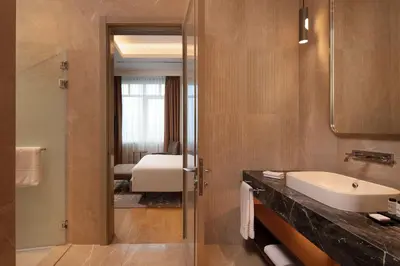 a bathroom with a sink and a mirror at Sheraton Istanbul Levent in Istanbul