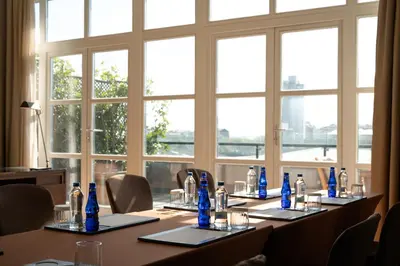 a conference room with a table with blue bottles on it at Park Hyatt Istanbul - Macka Palas in Istanbul
