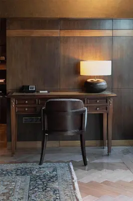a desk with a chair and a lamp on it at Park Hyatt Istanbul - Macka Palas in Istanbul