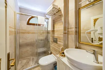 a bathroom with a sink and a shower at Hotel 1453 in Istanbul