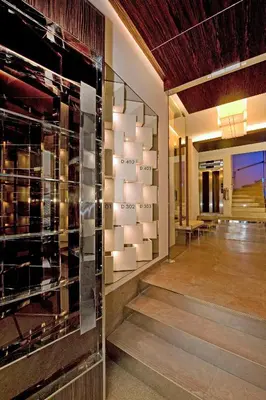 a lobby with a glass wall with a sign on it at Deger 16 Residences in Istanbul