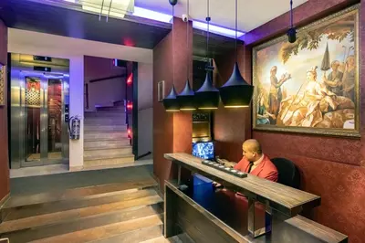 a man sitting at a bar in a restaurant at Deger 16 Residences in Istanbul
