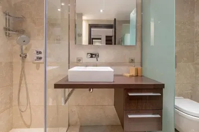 a bathroom with a sink and a shower at Deger 16 Residences in Istanbul