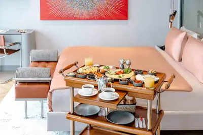 a tray of food on a table in a living room at AHC Taksim Hotel-Special Class in Istanbul