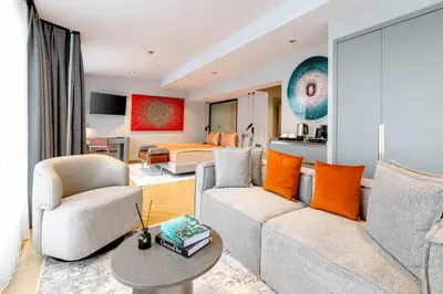 a living room with a couch and a bedroom at AHC Taksim Hotel-Special Class in Istanbul