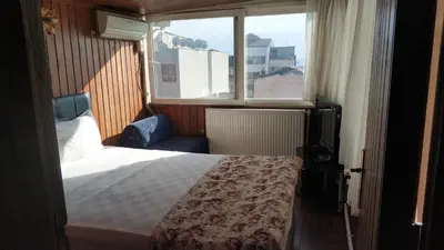 a hotel room with a bed and a window at Hotel Akkus in Istanbul