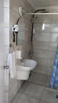 a bathroom with a sink and a mirror at Hotel Akkus in Istanbul