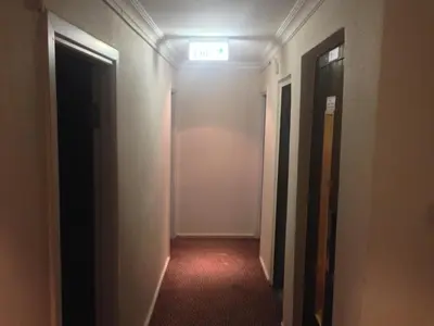 an empty hallway with a door and a light at Hotel Akkus in Istanbul