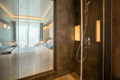 a bathroom with a shower with a glass door at Golden Tulip Istanbul Bayrampasa in Istanbul