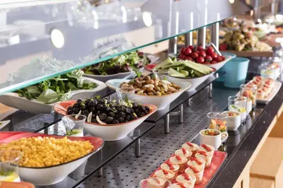 a buffet line with many plates of food at İstanbul Medikal Termal in Tuzla