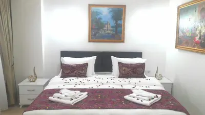 a bedroom with a bed with two towels on it at Golden Life Apart Hotel in Istanbul