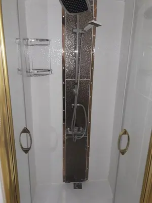 a shower with a glass door in a bathroom at Golden Life Apart Hotel in Istanbul