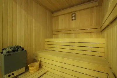 a sauna with a television in a wooden room at Trip Bosphorus Taksim Hotel in Istanbul