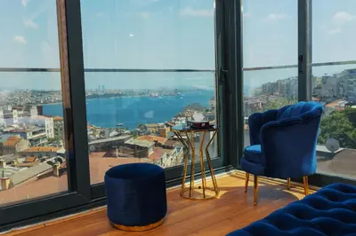 a room with a large window with a view of the city at Trip Bosphorus Taksim Hotel in Istanbul