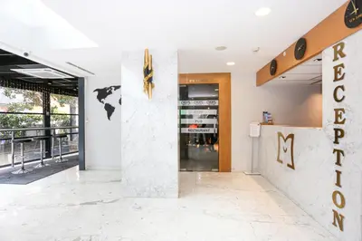 a lobby of a store with a sign on the wall at Milord Hotel in Istanbul