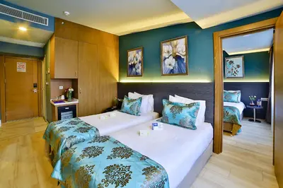 a hotel room with two beds in a room at The Tango Hotel İstanbul in Istanbul