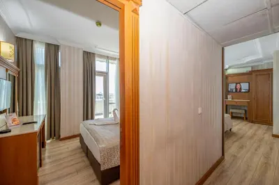 a hotel room with a bed and a mirror at Dalan Otel in Istanbul
