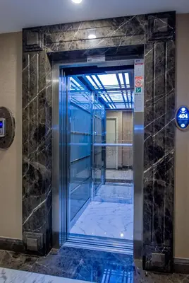 an elevator in a building with a glass door at Homelike Hotel in Istanbul